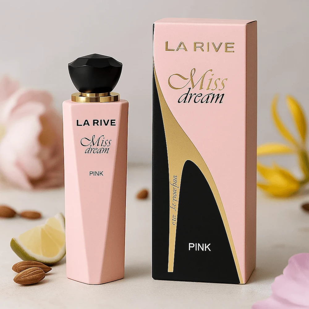 Frasco de perfume La Rive Miss Dream Pink em sua caixa rosa e preta, com amêndoas e flores decorativas no fundo.